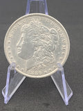 1886 Morgan Dollar in 100 Year Old History Of The Morgan Dollar Folder