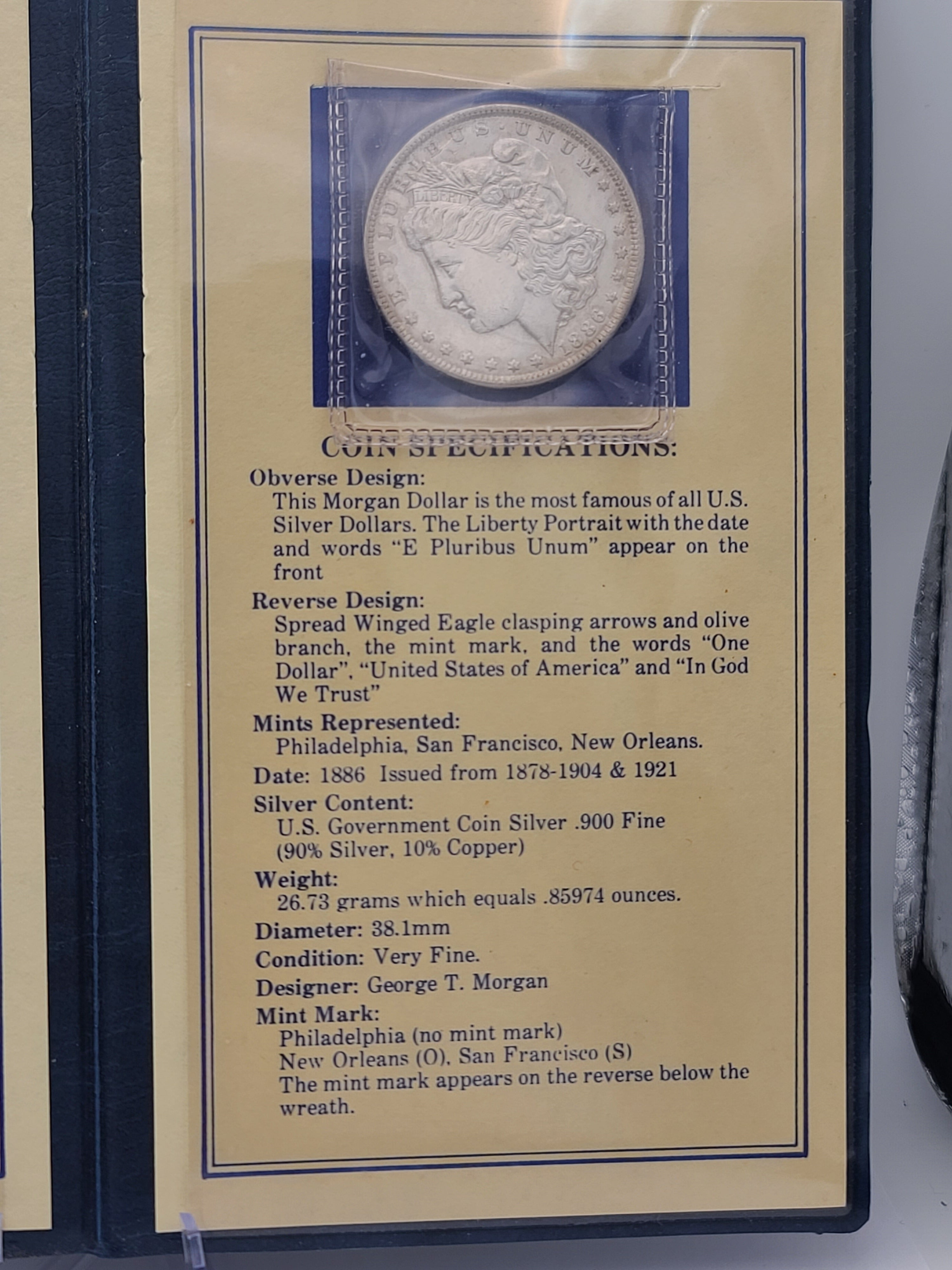 1886 Morgan Dollar in 100 Year Old History Of The Morgan Dollar Folder