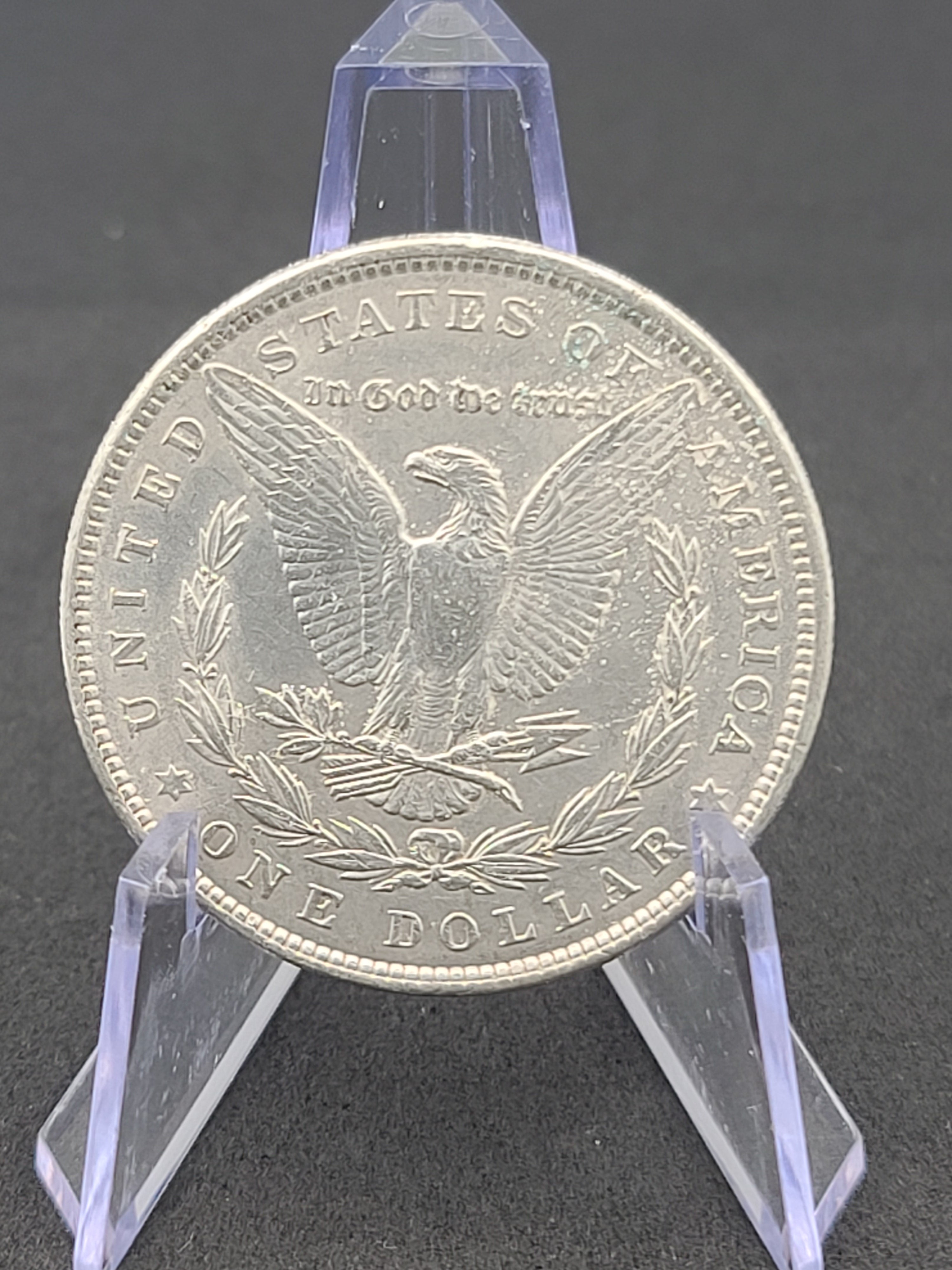 1886 Morgan Dollar in 100 Year Old History Of The Morgan Dollar Folder