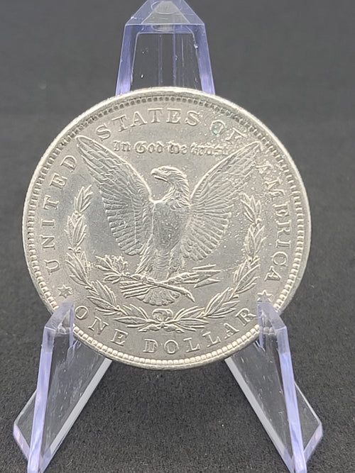 1886 Morgan Dollar in 100 Year Old History Of The Morgan Dollar Folder