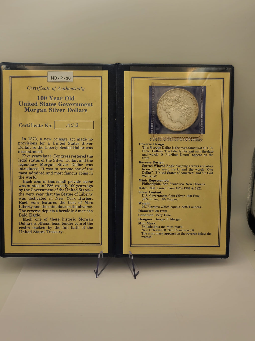 1886 Morgan Dollar in 100 Year Old History Of The Morgan Dollar Folder